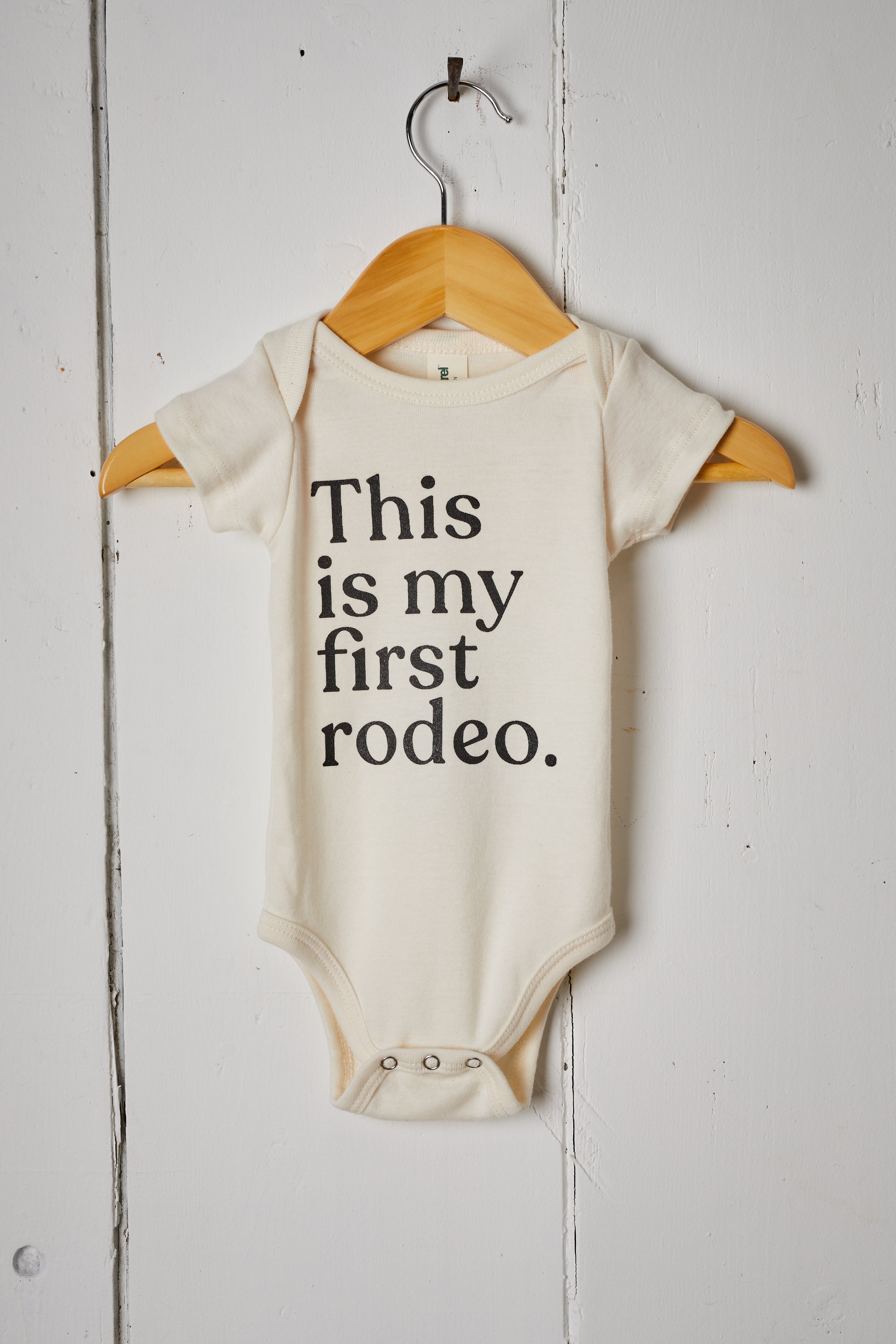CREAM THIS IS MY FIRST RODEO BABY ONESIE