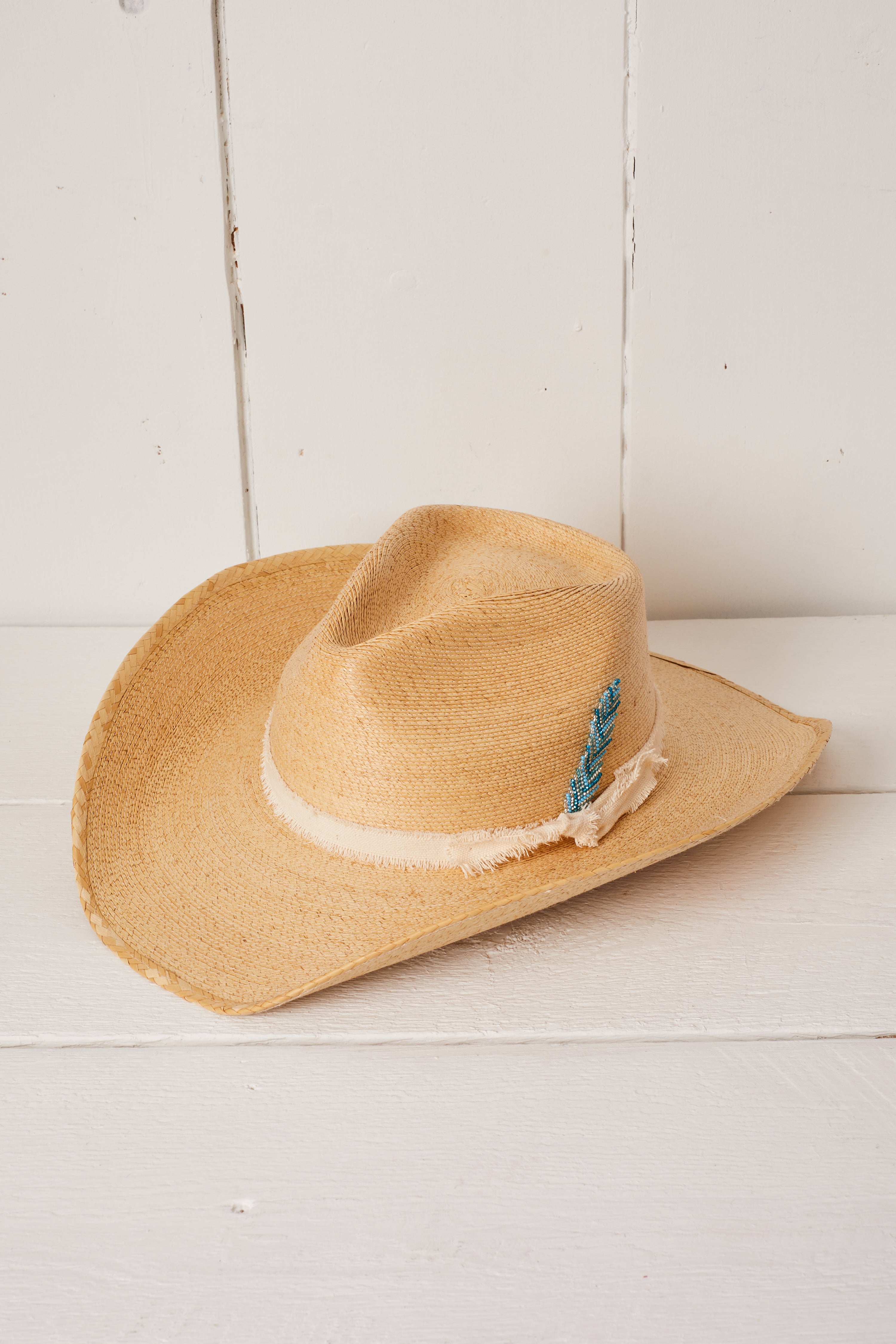STRAW COWBOY HAT WITH BEADED FEATHER