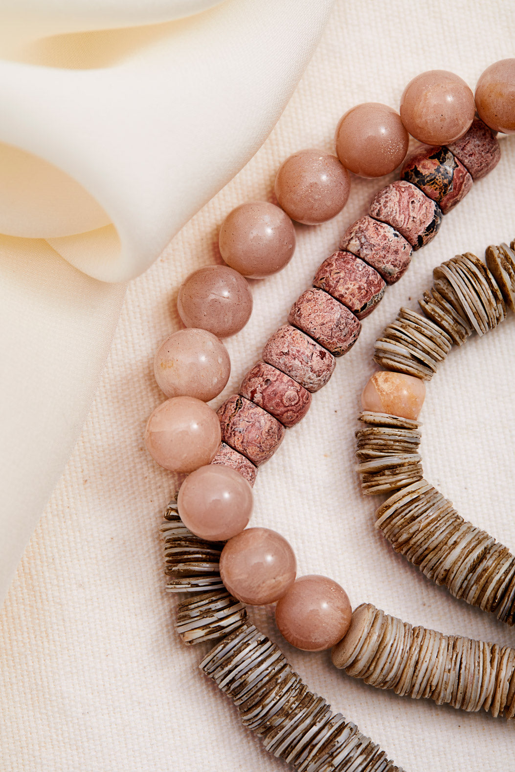 PINK MOONSTONE AND RHODOCHROSITE DOUBLE STRAND NECKLACE WITH NAGA SHELL PENDANTS