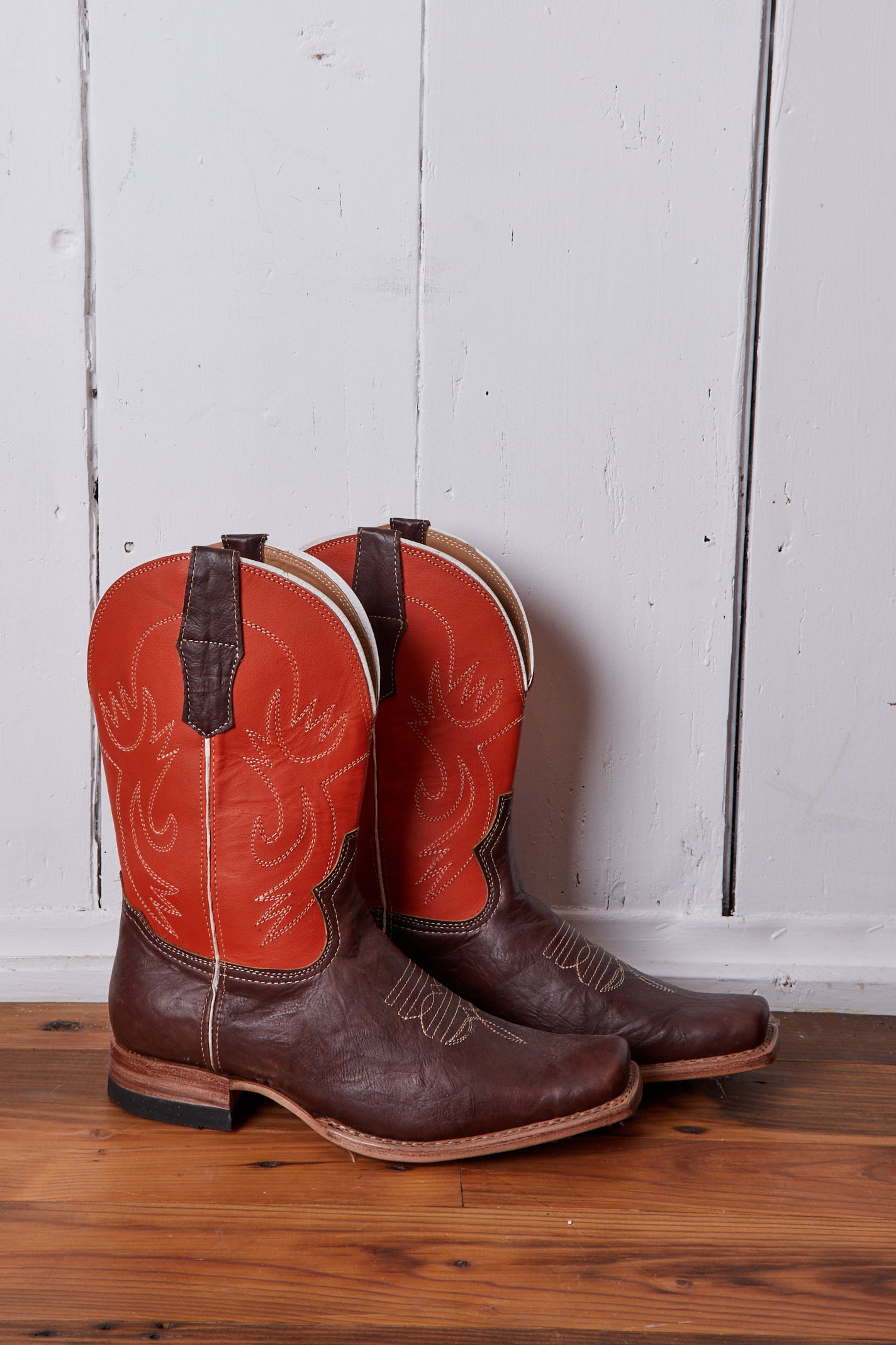 DARK BROWN AND ORANGE COWBOY BOOTS