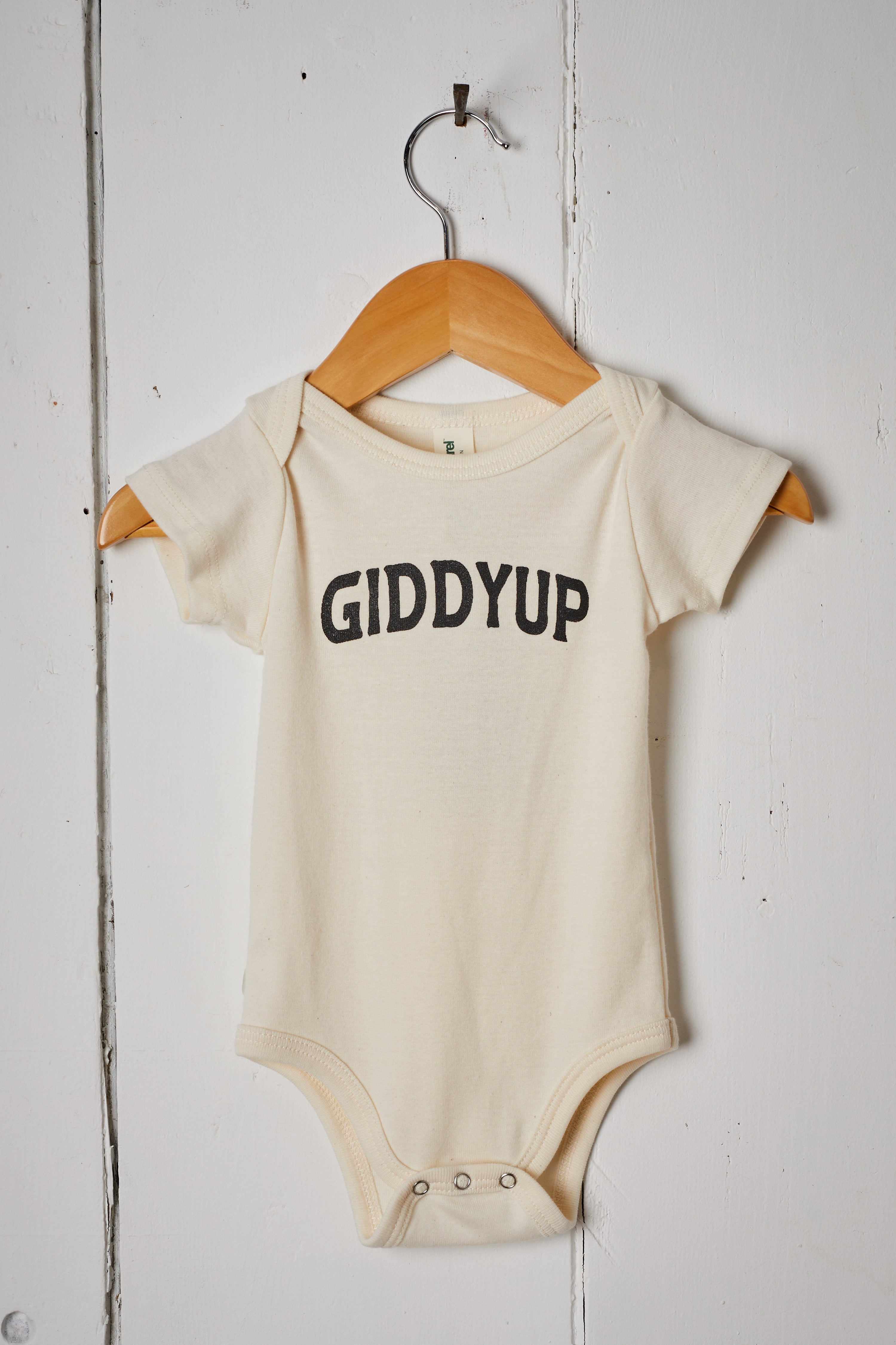 CREAM GIDDY UP BABY ONESIE